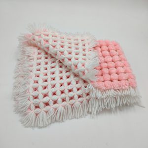 pom- pom blanket with tassels